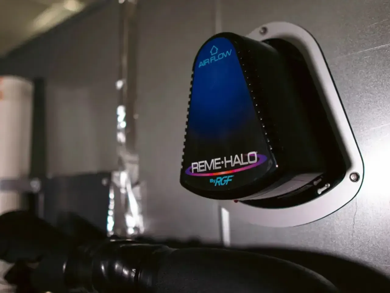 Technician installing Reme Halo air purifier