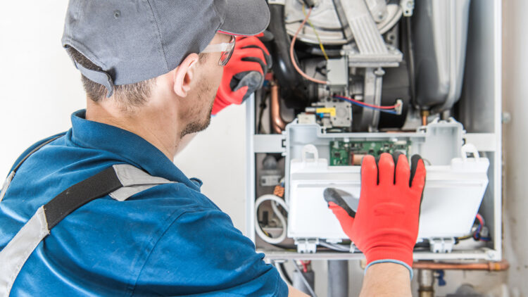 Technician working on a furnace